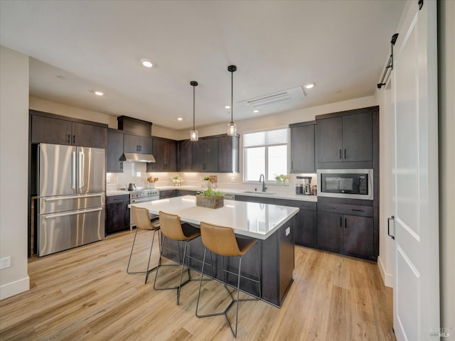 226 Verandah Ave, Novato, CA 94945 - kitchen with freestanding refrigerator, a sink, built in microwave, under cabinet range hood, and light wood-style floors