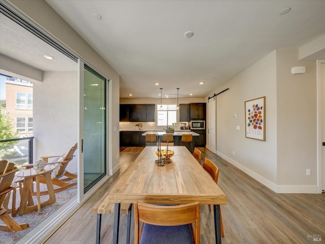 226 Verandah Ave, Novato, CA 94945 - dining space featuring a barn door, light wood-style floors, baseboards, and recessed lighting