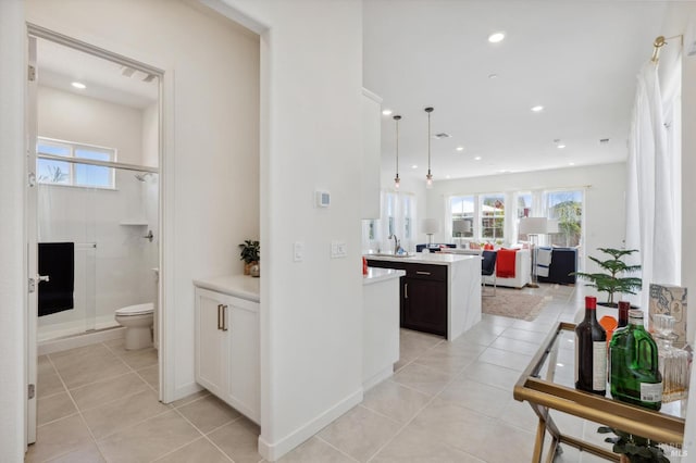 1749 Guadalupe St, Petaluma, CA 94952 - hallway featuring light tile patterned flooring, recessed lighting, and a sink