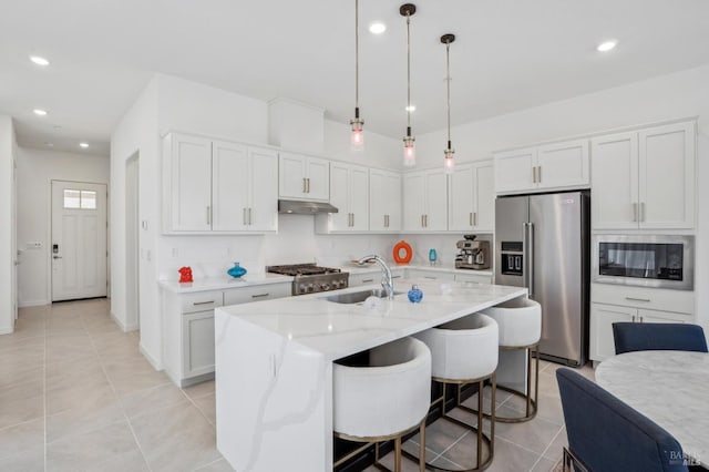 1749 Guadalupe St, Petaluma, CA 94952 - kitchen featuring high end refrigerator, black microwave, under cabinet range hood, a sink, and light tile patterned floors
