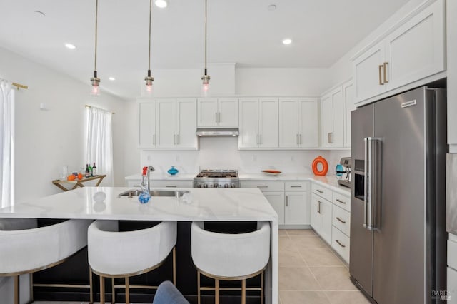 1749 Guadalupe St, Petaluma, CA 94952 - kitchen featuring high end refrigerator, a sink, under cabinet range hood, stove, and white cabinets