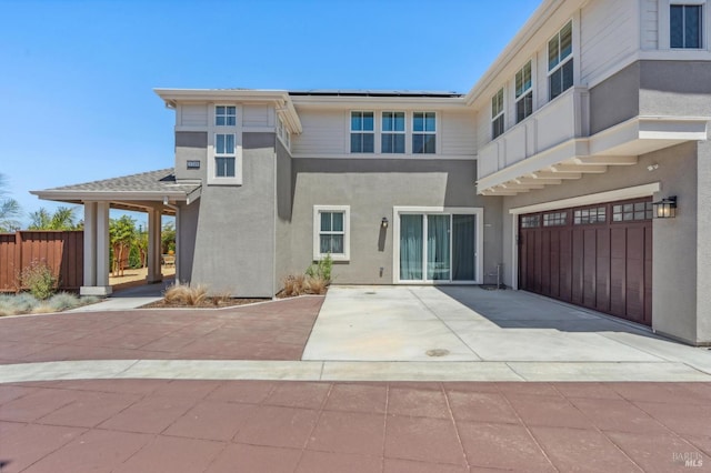 1749 Guadalupe St, Petaluma, CA 94952 - back of property with stucco siding, a garage, and driveway