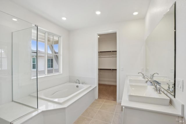 1749 Guadalupe St, Petaluma, CA 94952 - bathroom with tile patterned floors, a garden tub, recessed lighting, a walk in closet, and baseboards