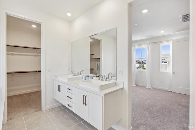 1749 Guadalupe St, Petaluma, CA 94952 - bathroom featuring a spacious closet, double vanity, baseboards, recessed lighting, and tile patterned floors