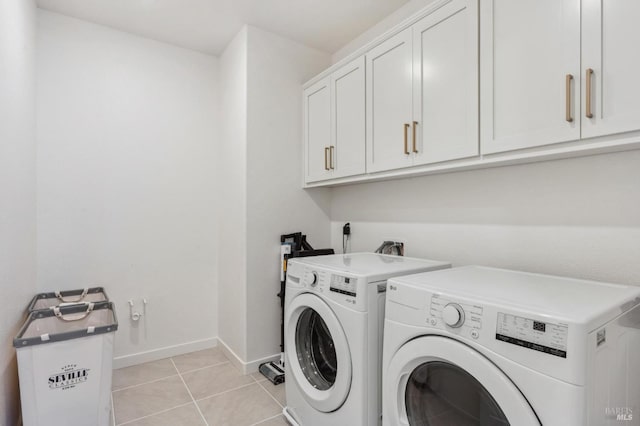 1749 Guadalupe St, Petaluma, CA 94952 - laundry room with cabinet space, washing machine and clothes dryer, baseboards, and light tile patterned floors