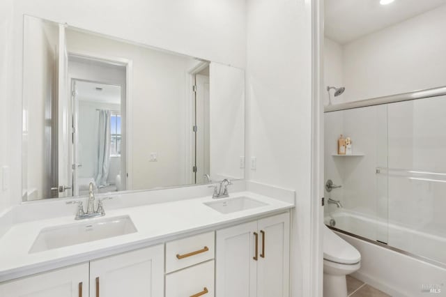 1749 Guadalupe St, Petaluma, CA 94952 - bathroom featuring toilet, combined bath / shower with glass door, double vanity, and tile patterned flooring