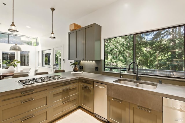 119 Marguerite Ave, Mill Valley, CA 94941 - kitchen featuring stainless steel gas stovetop, white dishwasher, a sink, hanging light fixtures, and a peninsula