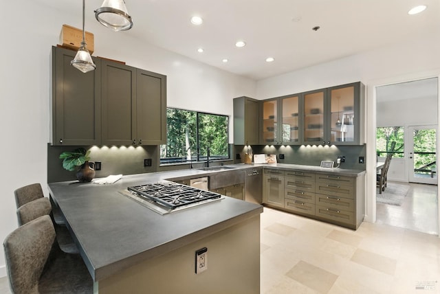 119 Marguerite Ave, Mill Valley, CA 94941 - kitchen featuring stainless steel appliances, a peninsula, a sink, recessed lighting, and glass insert cabinets