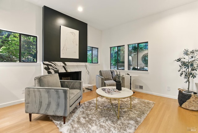 119 Marguerite Ave, Mill Valley, CA 94941 - sitting room with healthy amount of natural light, wood finished floors, a premium fireplace, and recessed lighting