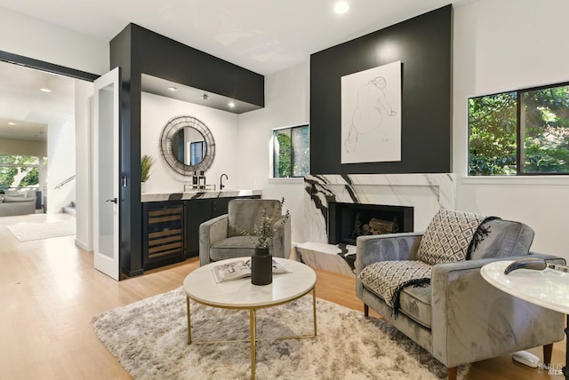 119 Marguerite Ave, Mill Valley, CA 94941 - living area featuring light wood-style floors, wine cooler, recessed lighting, and a high end fireplace