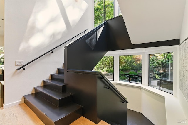 119 Marguerite Ave, Mill Valley, CA 94941 - staircase featuring a high ceiling, wood finished floors, and baseboards