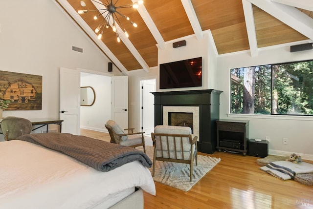 119 Marguerite Ave, Mill Valley, CA 94941 - bedroom with a chandelier, baseboards, light wood-style floors, high vaulted ceiling, and a fireplace