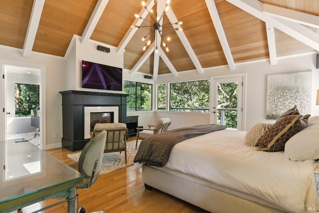 119 Marguerite Ave, Mill Valley, CA 94941 - bedroom with a chandelier, light wood finished floors, a glass covered fireplace, wooden ceiling, and access to outside