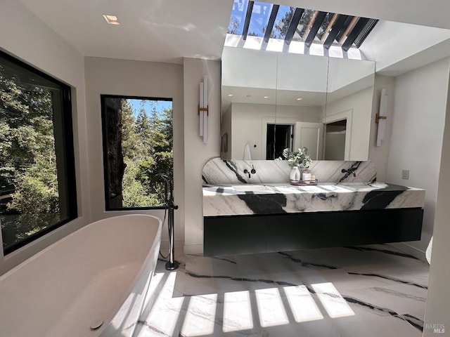 119 Marguerite Ave, Mill Valley, CA 94941 - full bathroom featuring healthy amount of natural light, a soaking tub, and double vanity