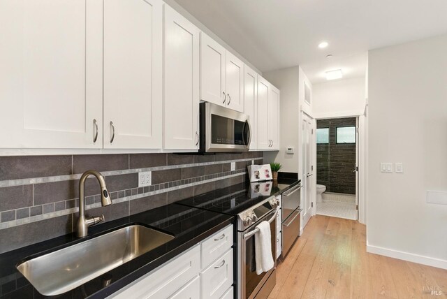 119 Marguerite Ave, Mill Valley, CA 94941 - living area with a skylight, light wood-style flooring, and baseboards