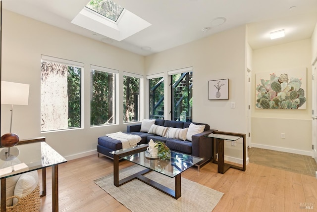 119 Marguerite Ave, Mill Valley, CA 94941 - living area with a skylight, light wood-type flooring, and baseboards