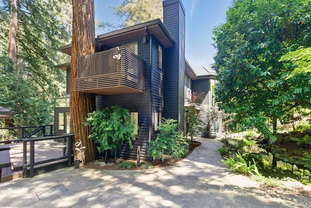 119 Marguerite Ave, Mill Valley, CA 94941 - view of side of home featuring a balcony and a chimney