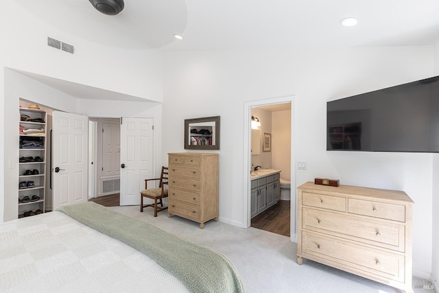 3336 Brittany Cir, Napa, CA 94558 - bedroom featuring light colored carpet, ensuite bathroom, a sink, and recessed lighting