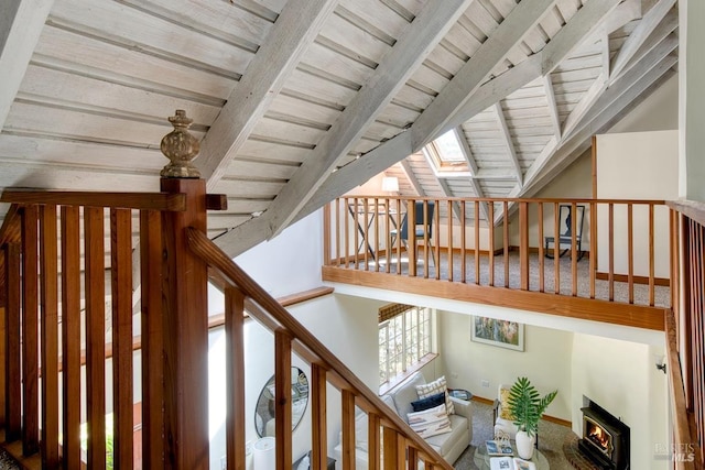 11 Inverness Way S, Inverness, CA 94937 - stairway with wood ceiling, a skylight, and a warm lit fireplace