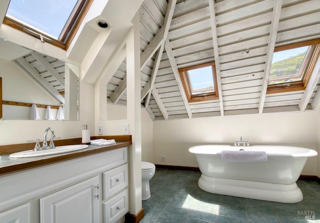 11 Inverness Way S, Inverness, CA 94937 - bathroom with a skylight, baseboards, a soaking tub, and vanity