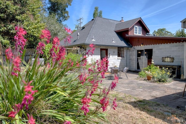 11 Inverness Way S, Inverness, CA 94937 - back of house featuring roof with shingles and a patio area