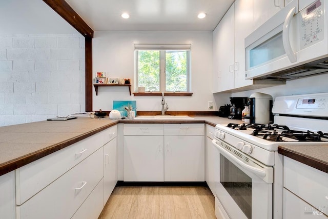 11 Inverness Way S, Inverness, CA 94937 - kitchen featuring white appliances, a sink, white cabinets, light wood-type flooring, and recessed lighting