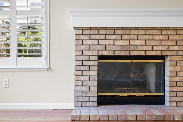 843 Cab Calloway Ct, Windsor, CA 95492 - detailed view of a fireplace, baseboards, and wood finished floors