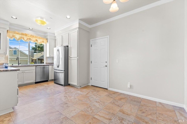 843 Cab Calloway Ct, Windsor, CA 95492 - kitchen with appliances with stainless steel finishes, decorative backsplash, crown molding, white cabinetry, and a sink