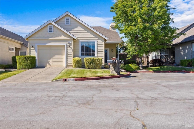 843 Cab Calloway Ct, Windsor, CA 95492 - view of front facade with concrete driveway, a garage, a front lawn, and a chimney