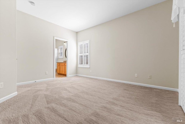 843 Cab Calloway Ct, Windsor, CA 95492 - unfurnished bedroom featuring baseboards, light carpet, and ensuite bathroom