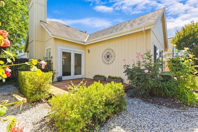 843 Cab Calloway Ct, Windsor, CA 95492 - entrance to property with french doors, a deck, a chimney, and roof with shingles