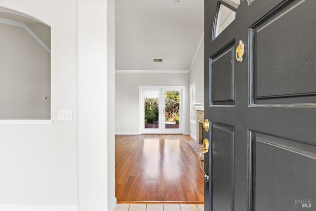 843 Cab Calloway Ct, Windsor, CA 95492 - foyer featuring crown molding, baseboards, french doors, wood finished floors, and arched walkways