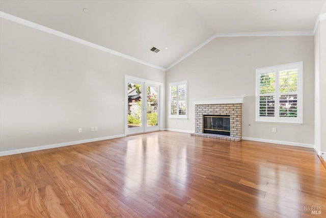 843 Cab Calloway Ct, Windsor, CA 95492 - unfurnished living room featuring wood finished floors, a brick fireplace, baseboards, high vaulted ceiling, and ornamental molding
