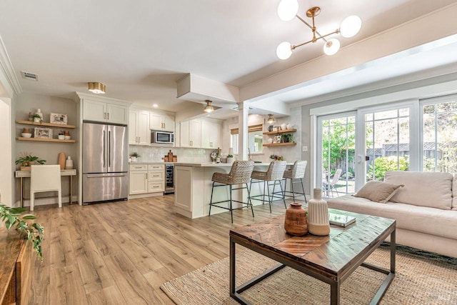37 Angela Ave, San Anselmo, CA 94960 - living area with light wood-type flooring, wine cooler, and a chandelier