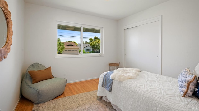40 Staghound Psge, Corte Madera, CA 94925 - bedroom with wood finished floors, a closet, and baseboards