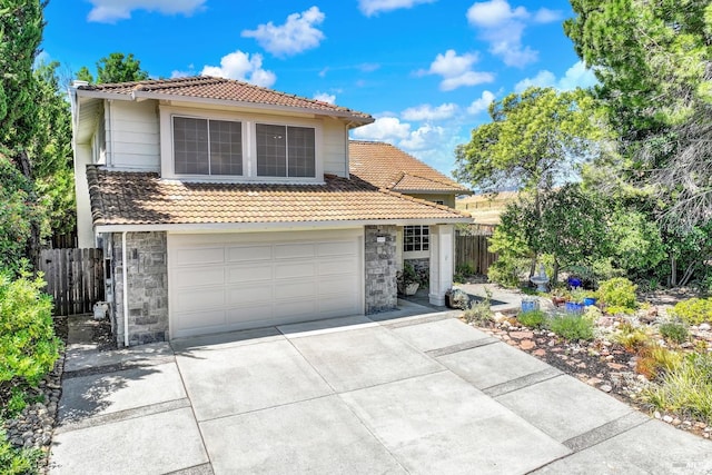 3327 Colonial Ct, Fairfield, CA 94534 - view of front of property with a tiled roof, stone siding, driveway, and a garage