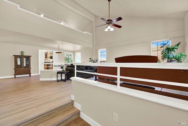3327 Colonial Ct, Fairfield, CA 94534 - hallway with light wood-style flooring, high vaulted ceiling, and baseboards
