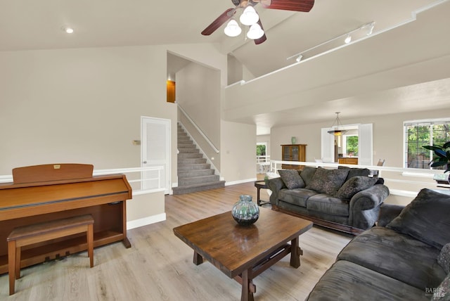 3327 Colonial Ct, Fairfield, CA 94534 - living room featuring light wood-style floors, ceiling fan, stairs, lofted ceiling, and baseboards