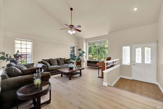 3327 Colonial Ct, Fairfield, CA 94534 - living area featuring high vaulted ceiling, plenty of natural light, light wood-style floors, ceiling fan, and baseboards