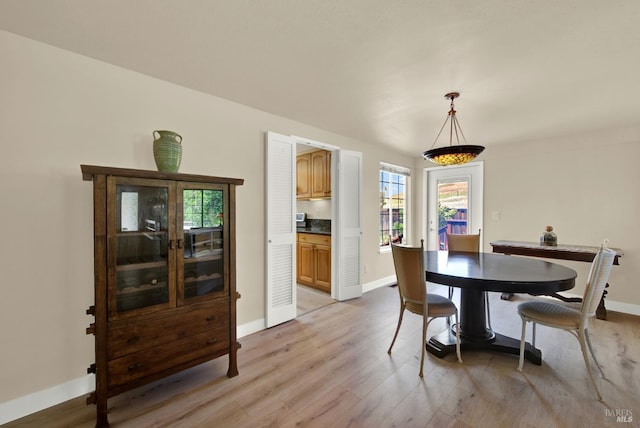 3327 Colonial Ct, Fairfield, CA 94534 - dining room featuring light wood-type flooring, baseboards, and plenty of natural light