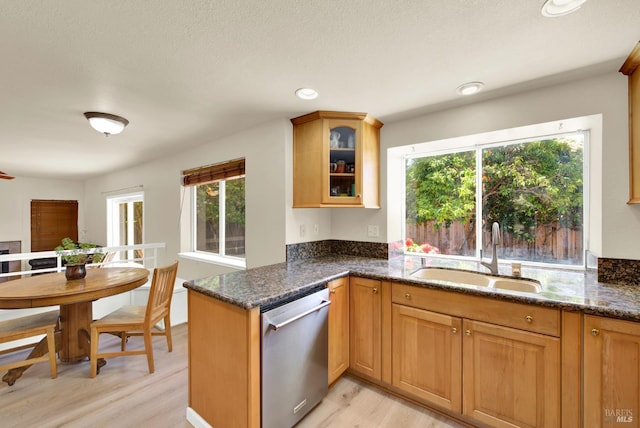 3327 Colonial Ct, Fairfield, CA 94534 - kitchen featuring dishwasher, a sink, light wood-style floors, glass insert cabinets, and dark stone counters