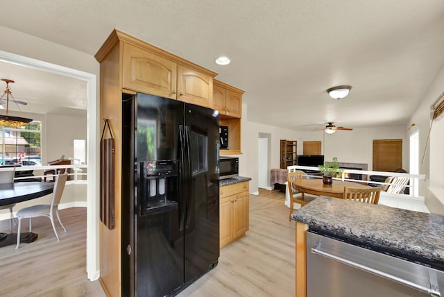 3327 Colonial Ct, Fairfield, CA 94534 - kitchen featuring black fridge with ice dispenser, stainless steel dishwasher, dark countertops, ceiling fan, and light wood-type flooring