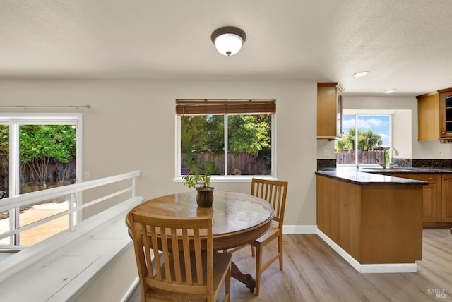 3327 Colonial Ct, Fairfield, CA 94534 - dining space with light wood finished floors, healthy amount of natural light, a textured ceiling, baseboards, and recessed lighting
