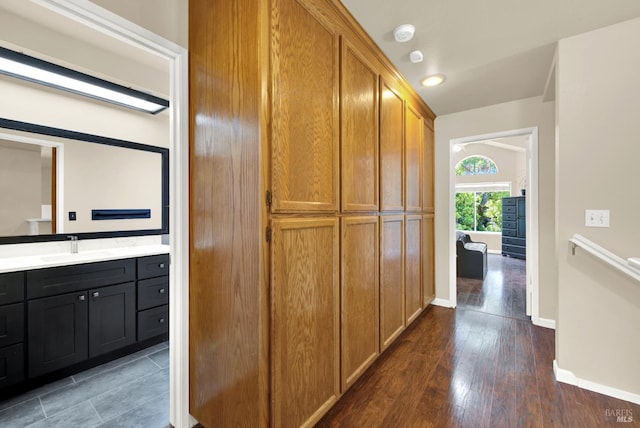 3327 Colonial Ct, Fairfield, CA 94534 - hallway featuring baseboards, wood finished floors, and a sink