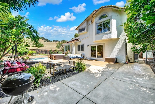 3327 Colonial Ct, Fairfield, CA 94534 - back of house with stucco siding, an outdoor hangout area, and a fenced backyard