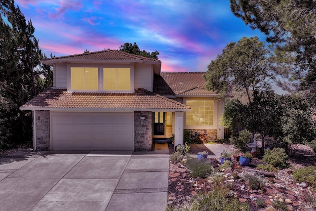 3327 Colonial Ct, Fairfield, CA 94534 - view of front of property featuring a tile roof, driveway, stone siding, and an attached garage