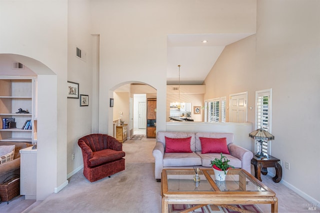 2016 Stonefield Ln, Santa Rosa, CA 95403 - living area featuring high vaulted ceiling, carpet floors, baseboards, and arched walkways