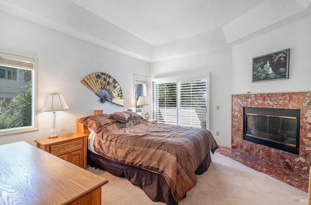 2016 Stonefield Ln, Santa Rosa, CA 95403 - bedroom with light colored carpet, multiple windows, a fireplace, and access to exterior