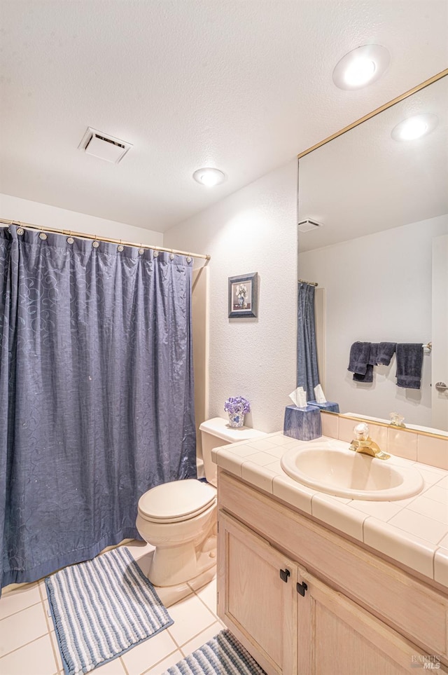 2016 Stonefield Ln, Santa Rosa, CA 95403 - full bath featuring vanity, toilet, tile patterned flooring, and a textured ceiling