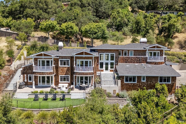 6 Live Oak Way, San Rafael, CA 94901 - rear view of house with french doors, stairs, a balcony, a patio area, and a fenced backyard